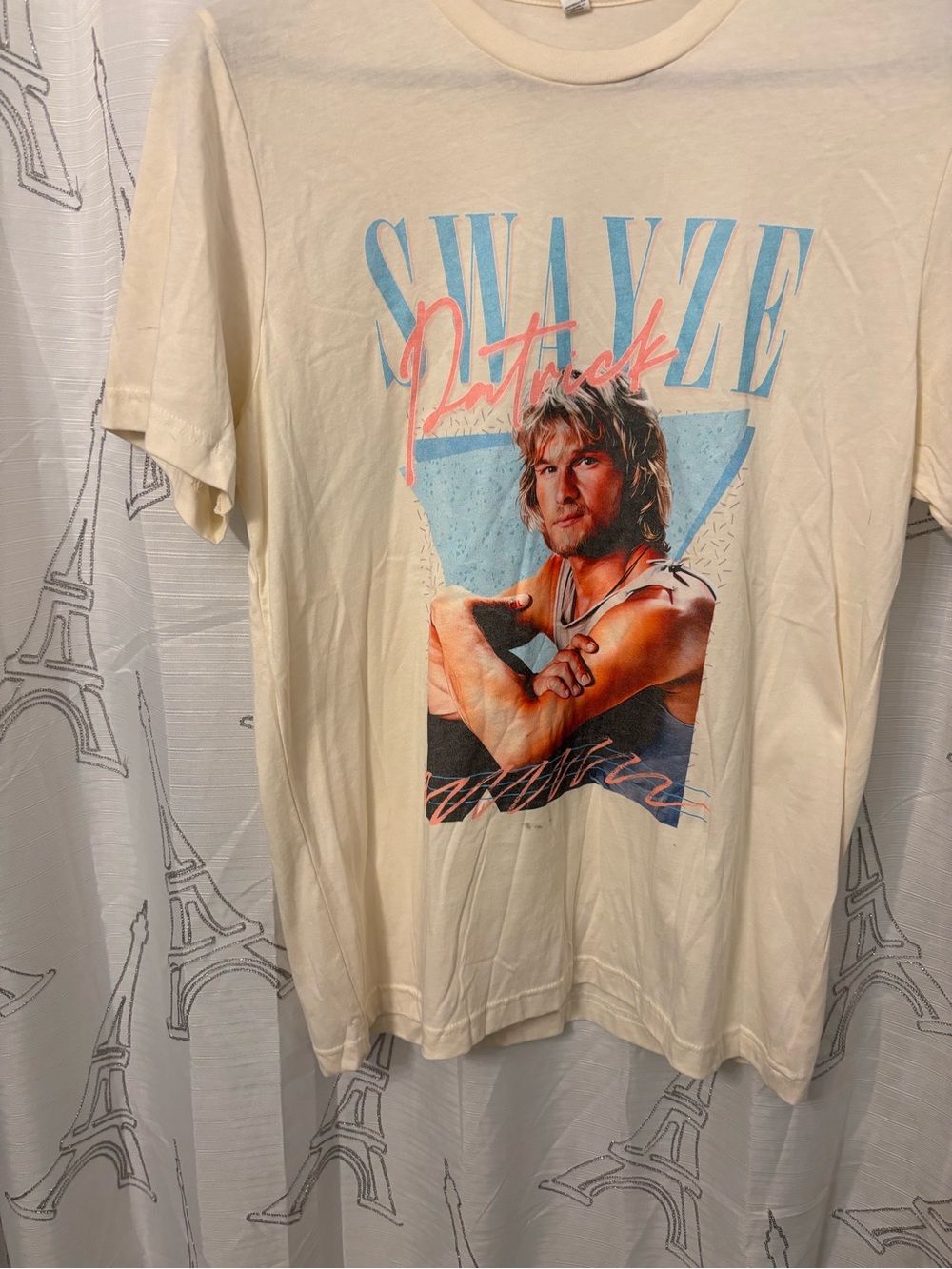 Bella Canvas Cream Short Sleeve Graphic Tee with Blue and Pink Print Pat Swayze